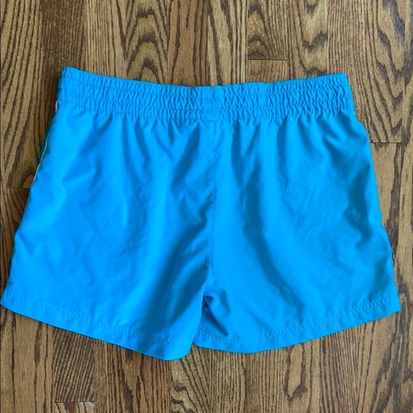 Bright turquoise with white side stripe Nike shorts with pockets, size women’s L - Picture 5 of 16